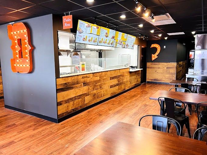 Dickey's order counter with menu boards and feature letter
