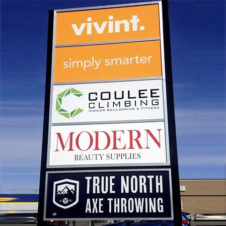 Multi-tenant pylon sign with panels for several local businesses