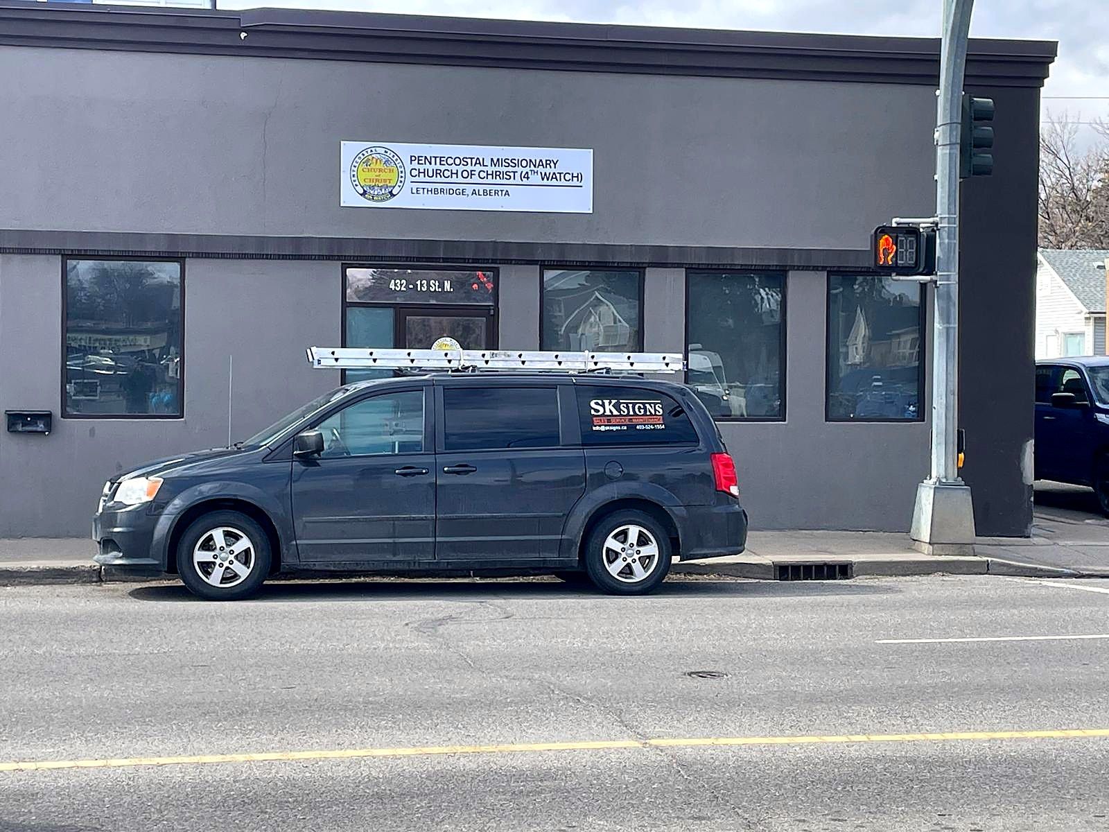 Street view of the church building with its new sign and the SK Signs van outside