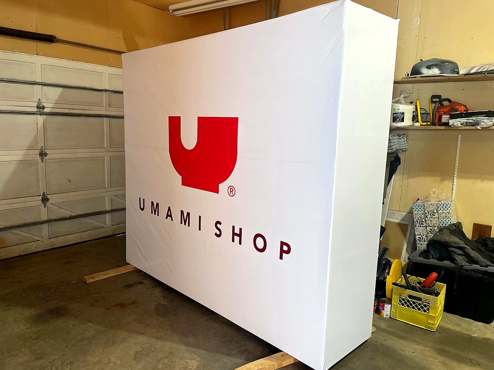 Finished Umami Shop sign cabinet standing in the SK Signs shop