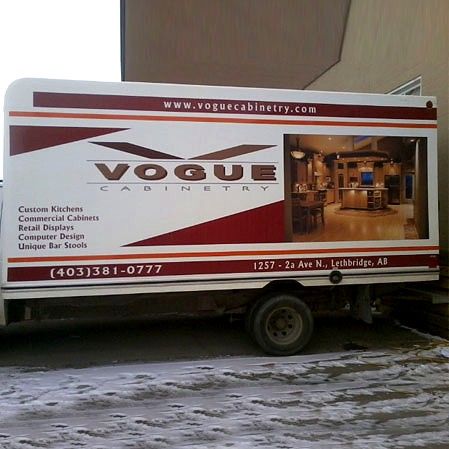 Box truck with Vogue Cabinetry graphics and a kitchen photo